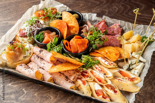 Slika na platnu A delectable assortment of antipasto, charcuterie, and cheese platters arranged
