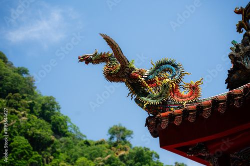A traditional Chinese dragon adorns the roof of Futian Temple on Lion’s Head Mountain, symbolizing power, protection, and prosperity within Taiwanese religious architecture.

