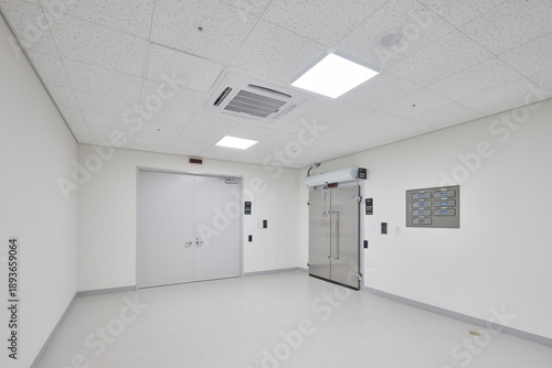 Фотография Minimalist white interior of a commercial kitchen or cold storage