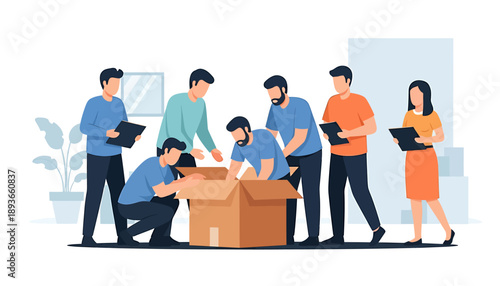 Team working together packing a large cardboard box for shipping.