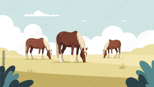 Three brown and white horses graze peacefully on a golden grassy field under a sky