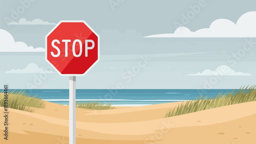 Red stop sign stands on a beach with ocean and sky in background