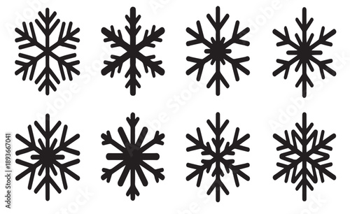 A set of eight black and white snowflake designs
arranged in two rows of four