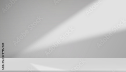 Minimal gray background with spotlight and empty podium for product display.Vector backdrop for modern branding,luxury mockup,fashion cosmetics,tech presentation,monochrome design