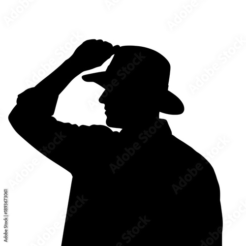 Silhouette of a man wearing a hat, looking thoughtful and contemplative.