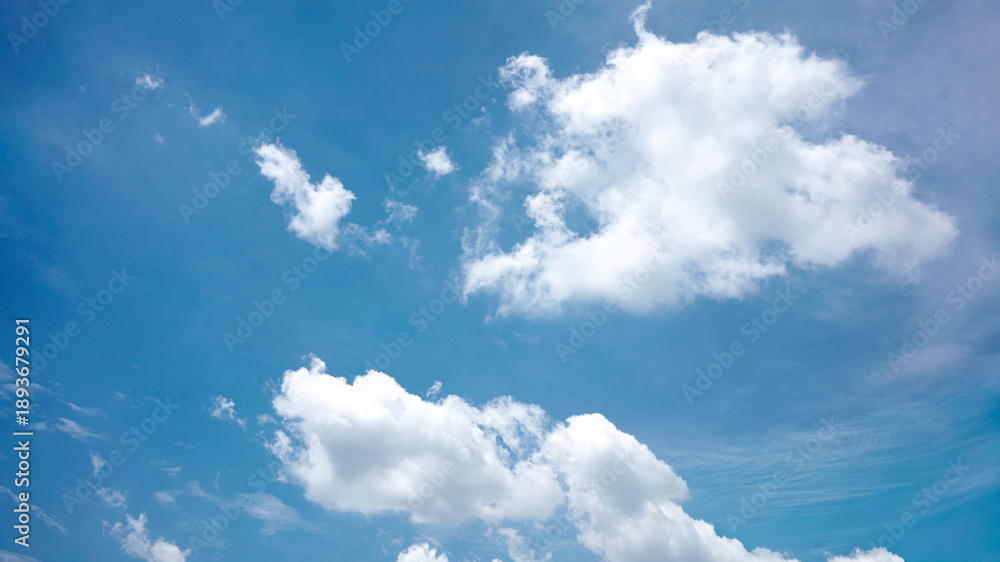 Fototapeta premium Background of beautiful, bright, cloudy blue sky with many clouds, sunny weather during the day during summer in tropical country