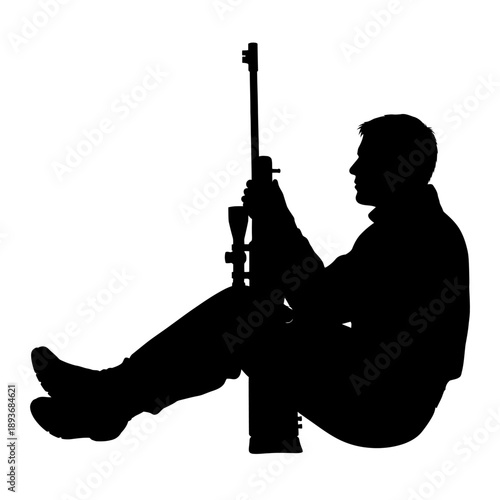 Silhouette of a man sitting and holding a rifle.