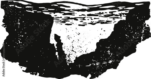 Rugged canyon landscape with steep cliffs and textured rock formations in black and white