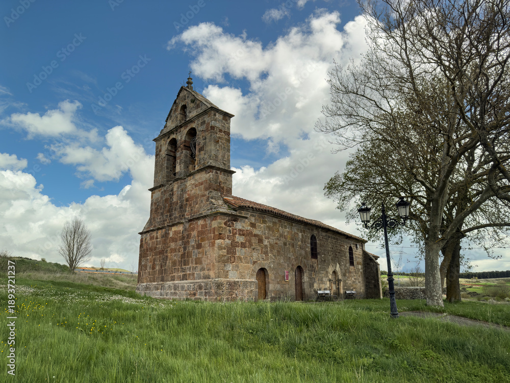 Naklejka premium Bell gable and stone facade of San Miguel Church in Aguilar de Campoo, Palencia