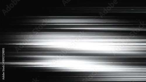 Abstract blurred white light streaks on black background