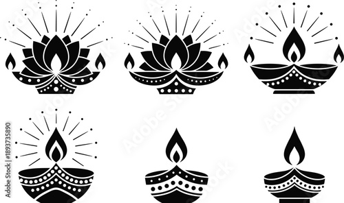 Traditional Indian oil lamp diya set with decorative lotus designs and glowing flames for Diwali festival and sacred religious celebration icons.