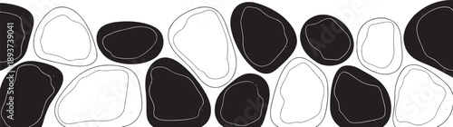 Black and white irregular shaped stones are juxtaposed in an alternating pattern forming an abstract, high-contrast decorative border suitable for design projects.