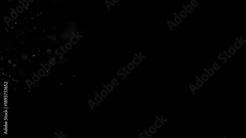 Atmospheric floating particles and bokeh light specks.