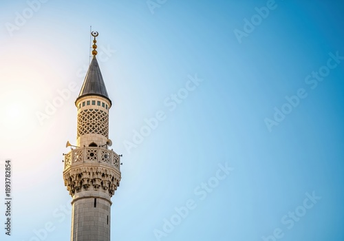 Wallpaper Mural Islamic minaret against a clear blue sky, architectural detail Torontodigital.ca