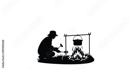 Silhouette of a person cooking over a campfire outdoors