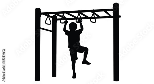 Silhouette of a child performing gymnastic rings exercise outdoors
