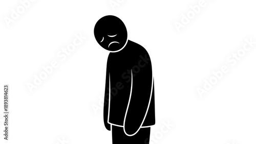 Sad person standing alone with head down