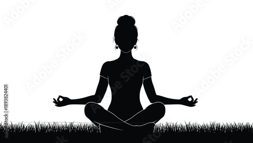 Black and white silhouette of woman sitting in lotus pose on grass practicing yoga for meditation wellness mindfulness and spirituality