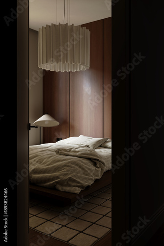 Φωτογραφία Moody modern bedroom viewed through doorway with bed and pendant lighting