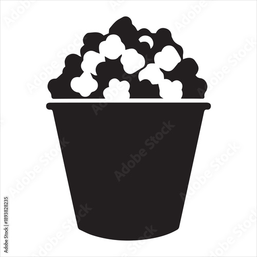 Black silhouette of popcorn bucket filled to brim with popcorn, isolated vector graphic for snacks and events, versatile background option
