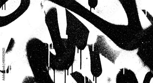 Black and white abstract graffiti art on a wall.