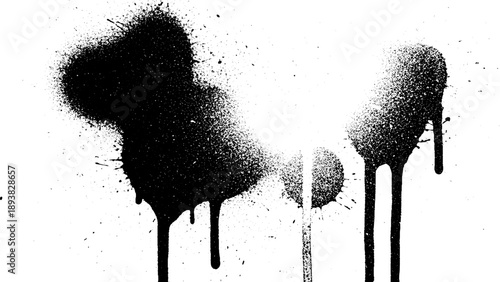 Black spray paint drips and splatters on white surface.