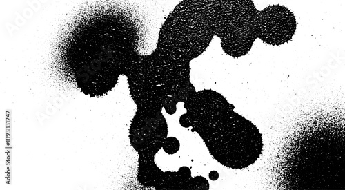 Abstract black ink splatter on white background.