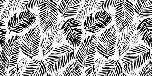 Black and white tropical leaf pattern with dense foliage