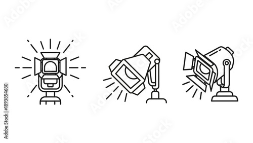 Studio lights on stands shining brightly.