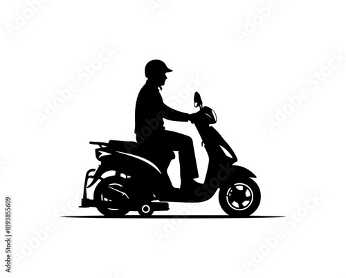 Silhouette of a Man Riding a Scooter