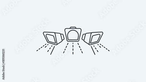 Three studio flash lights on stands.