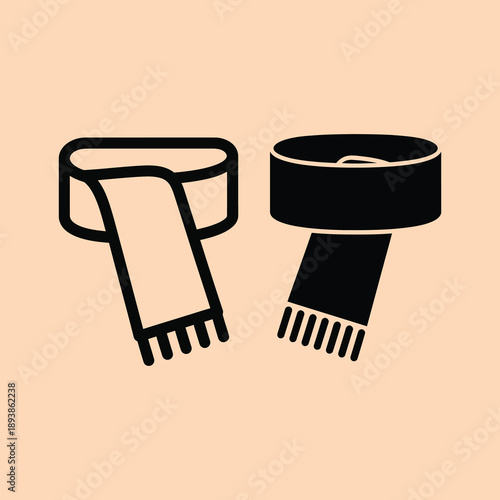 Two stylish scarves in black and beige colors on a solid peach background fashion accessories