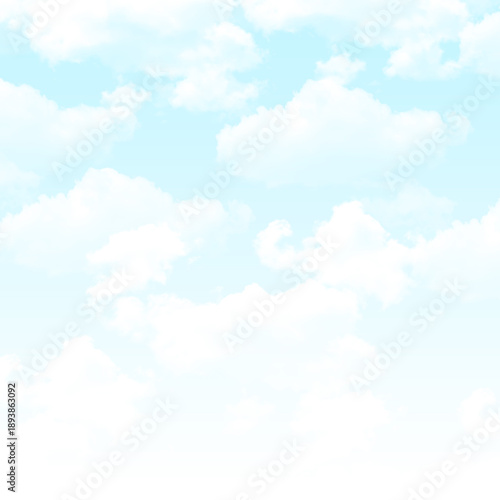 Soft white clouds float in serene light blue sky