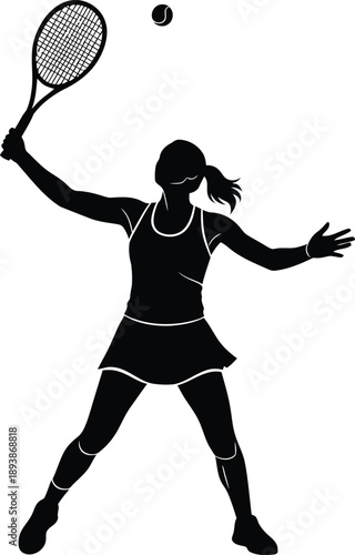 Silhouette of a female tennis player serving a ball in midair during a match or practice session
