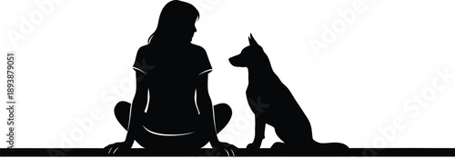 Silhouette of a girl sitting with her dog