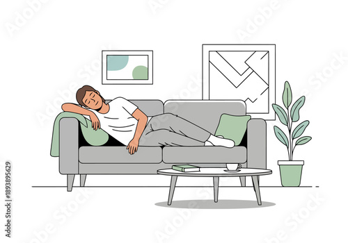 Young man resting comfortably on a sofa in a modern living room with minimalist decor and a coffee table