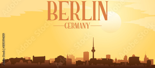 Golden yellow panoramic poster of the city skyline with misty background buildings and clouds of BERLIN, GERMANY