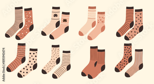 Selection of eight pairs of cozy patterned socks in warm earthy tones including stripes, polka dots, hearts, and floral designs.