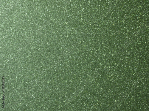 Green sparkle background. Deep green glitter background. Green glimmer. Abstract twinkle texture. Glitter surface. Glimmer layout. Holiday layout. Emerald green luxury surface. Celebration background.