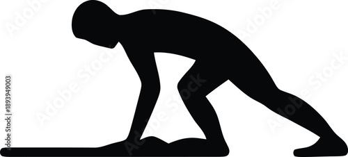 Silhouette of a person in a starting position for a race