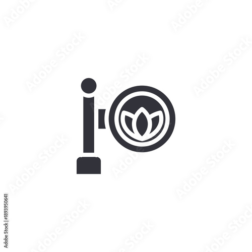 Decorative spa signpost with lotus symbol icon representing wellness center direction, branding signage, and relaxation guidance.