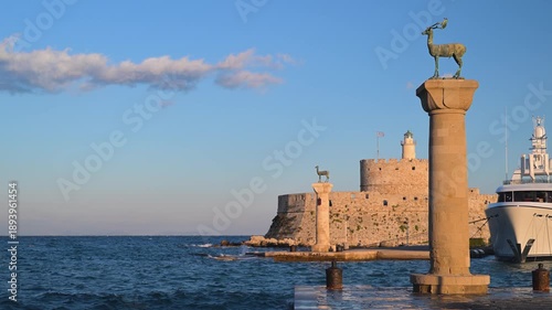 Doe and stag statues at Mandraki Harbor in Rhodes Greece