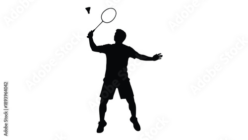 Silhouette of a badminton player preparing to strike the shuttlecock