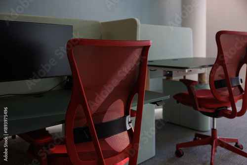 Two empty office desks and chairs, modern design.