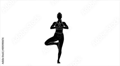 Woman practices yoga in tree pose on background
