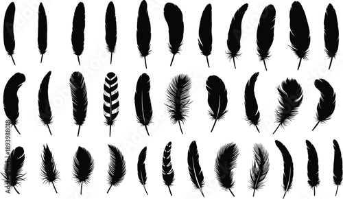 Beautiful cinematic aerial view of majestic snow capped mountain peaks reflecting in a calm blue lake during a vibrant sunset with dramatic orange sky