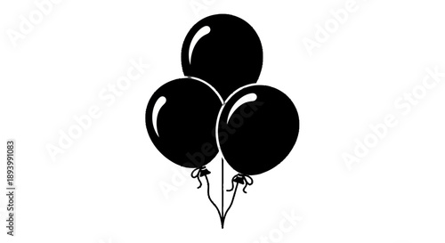 A cluster of three black balloons tied together with strings floats upwards.