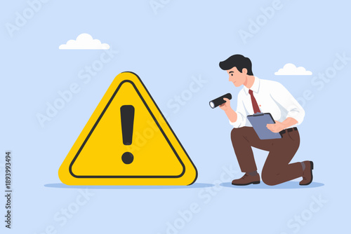 Man Investigating Warning Sign