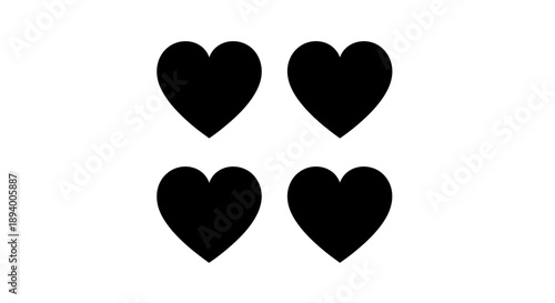 Four solid black hearts arranged in a two by two grid on a.