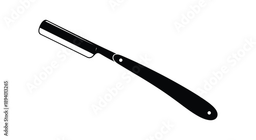 A sleek black straight razor is presented on a white background showcasing its classic design as a striking silhouette